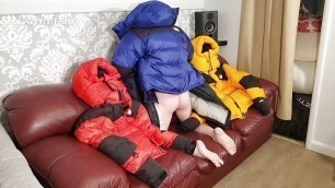 HumpingNorth Face Baltoro Down Jackets on Leather Couch Sofa.