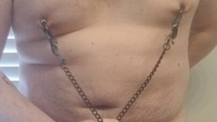 Fat sissy rubs his little cock with nipple clamps on
