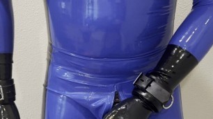 Shiny blue rubber gimp cumshot