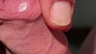 Edging his big cock head with his own foreskin until he cums